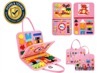 Valigetta Manine rosa aperta con forme, fibbie e stringhe, e i pannelli con orologio e puzzle dell'orsetto